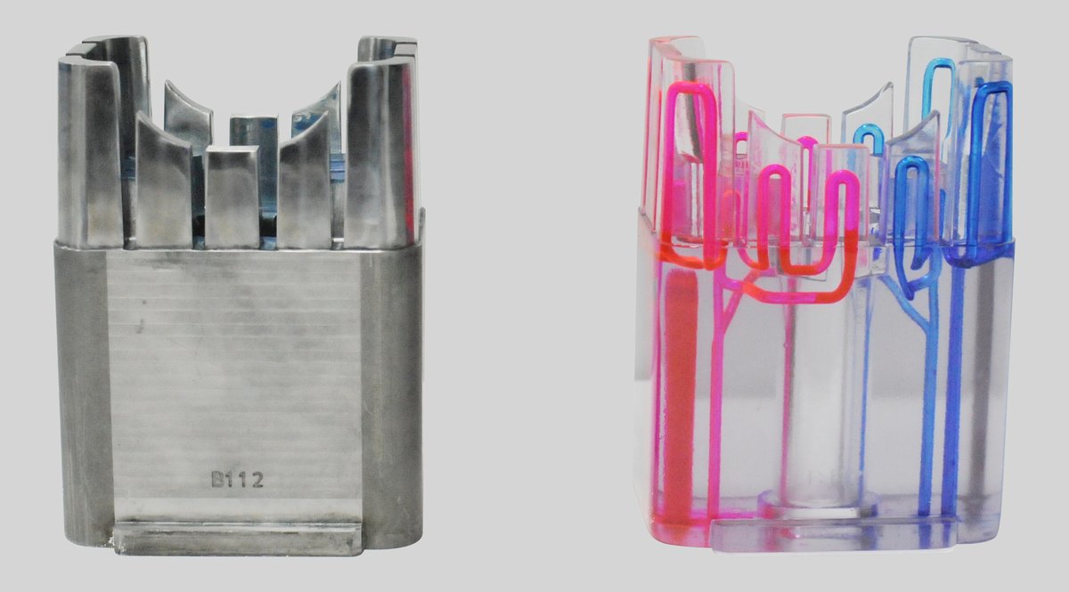 Mould insert with conformal cooling channels, steel part next to a transparent model